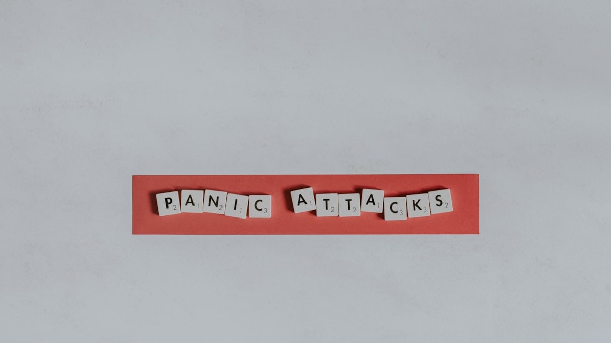 a red piece of paper with the words panic attacks spelled on it